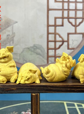 黄杨木雕刻四喜猪手把件