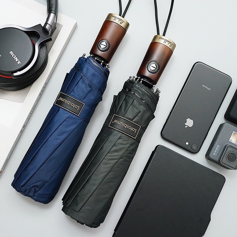 七行 德国铜头木柄黑胶十骨结实防风晴雨伞折叠自动伞防紫外男女