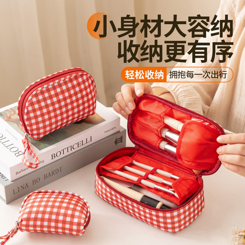 义乌市为纳箱包有限公司高颜值化妆包女大容量便携立式分区防水手