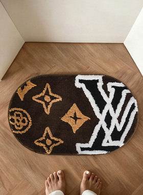 轻奢潮牌风簇绒地毯经典标识图案入户垫高级黑金配色家用卧室脚垫