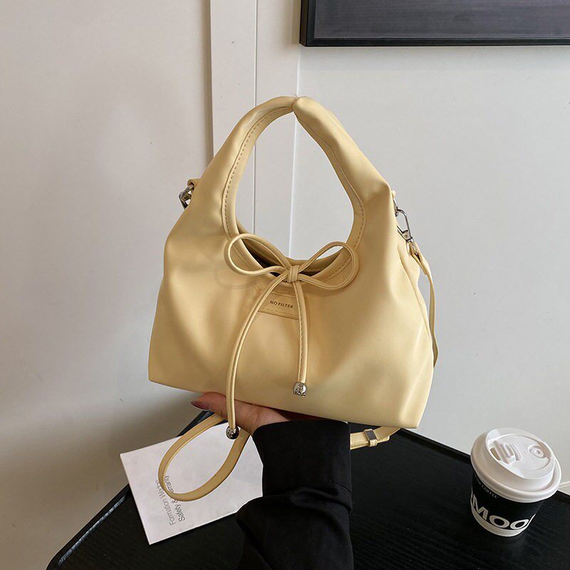 韩版简约手提水桶包包女式2025新款春夏时尚肩包百搭通勤斜挎包