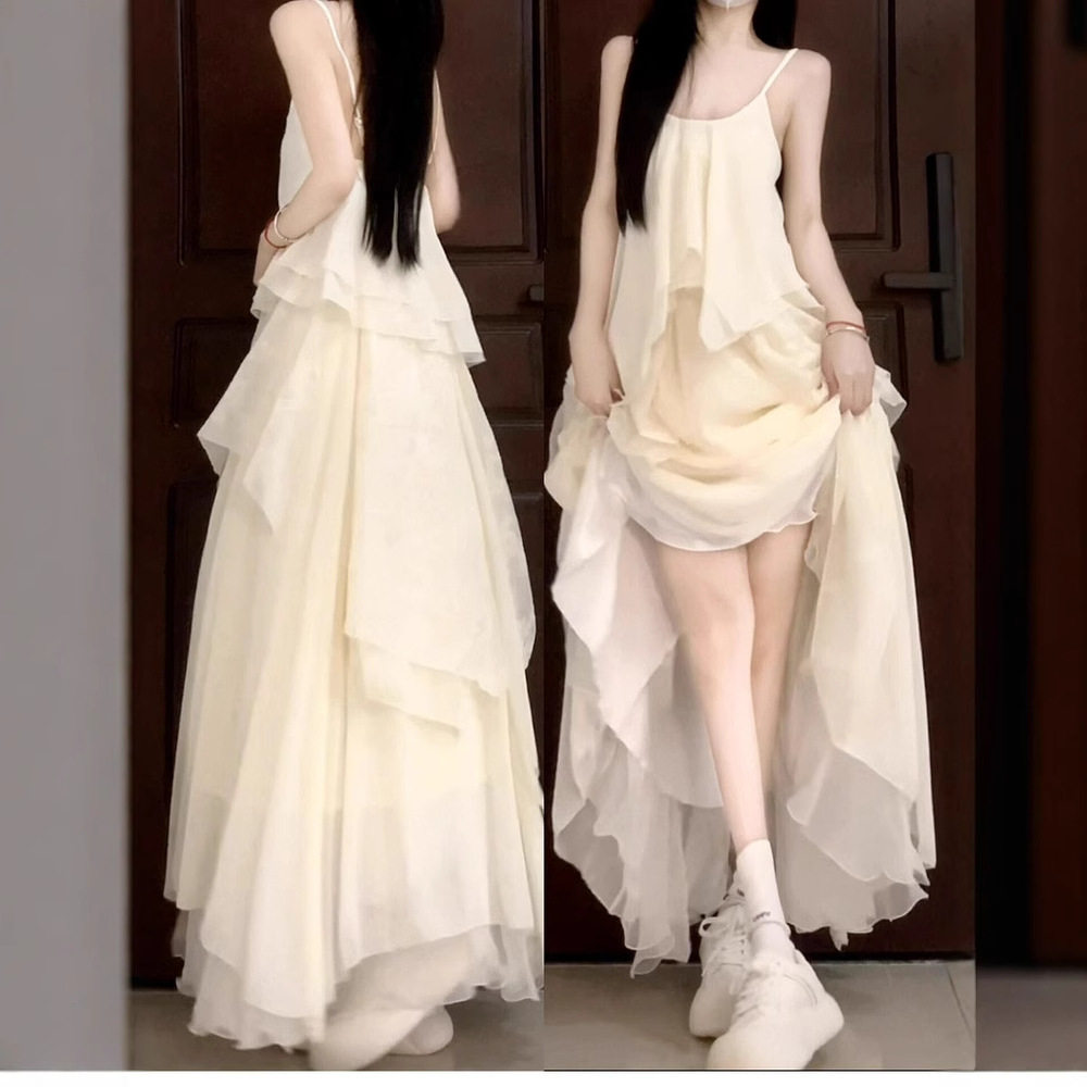 2025新款杏色吊带连衣裙子女装夏季法式小个子海边度假不规则长裙