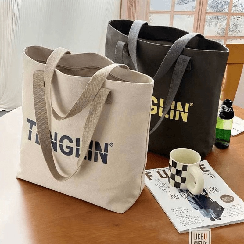 休闲简约大容量包包女2025新款百搭字母学生上课通勤托特包帆布包