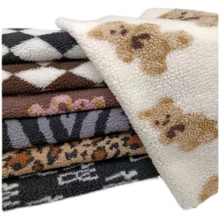 新款卡通羊羔绒布料毛绒面料服装布料面料加厚提花颗粒绒玩偶绒布