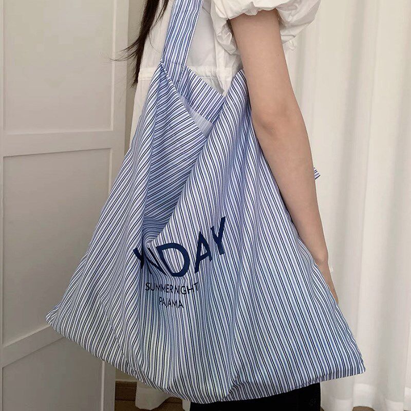 大容量蓝色帆布包女2024新款学生设计感小众斜挎百搭单肩手提包袋