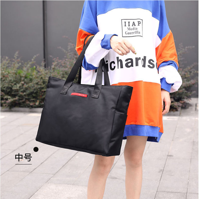 装衣服的手提袋子帆布收纳袋大容量整理学生男女行李包可套拉杆箱