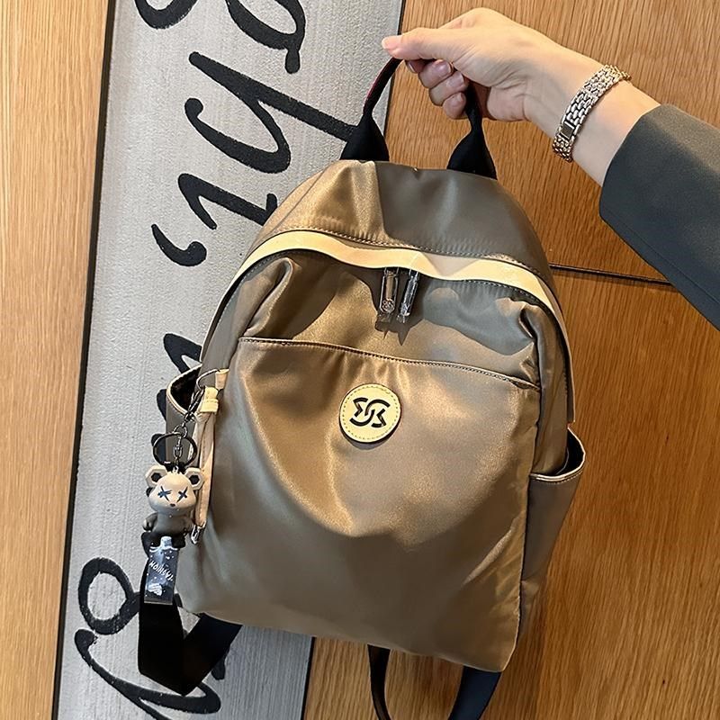 2024冬新款时尚小众双肩包女旅行背包高级感通勤书包牛津布轻便潮