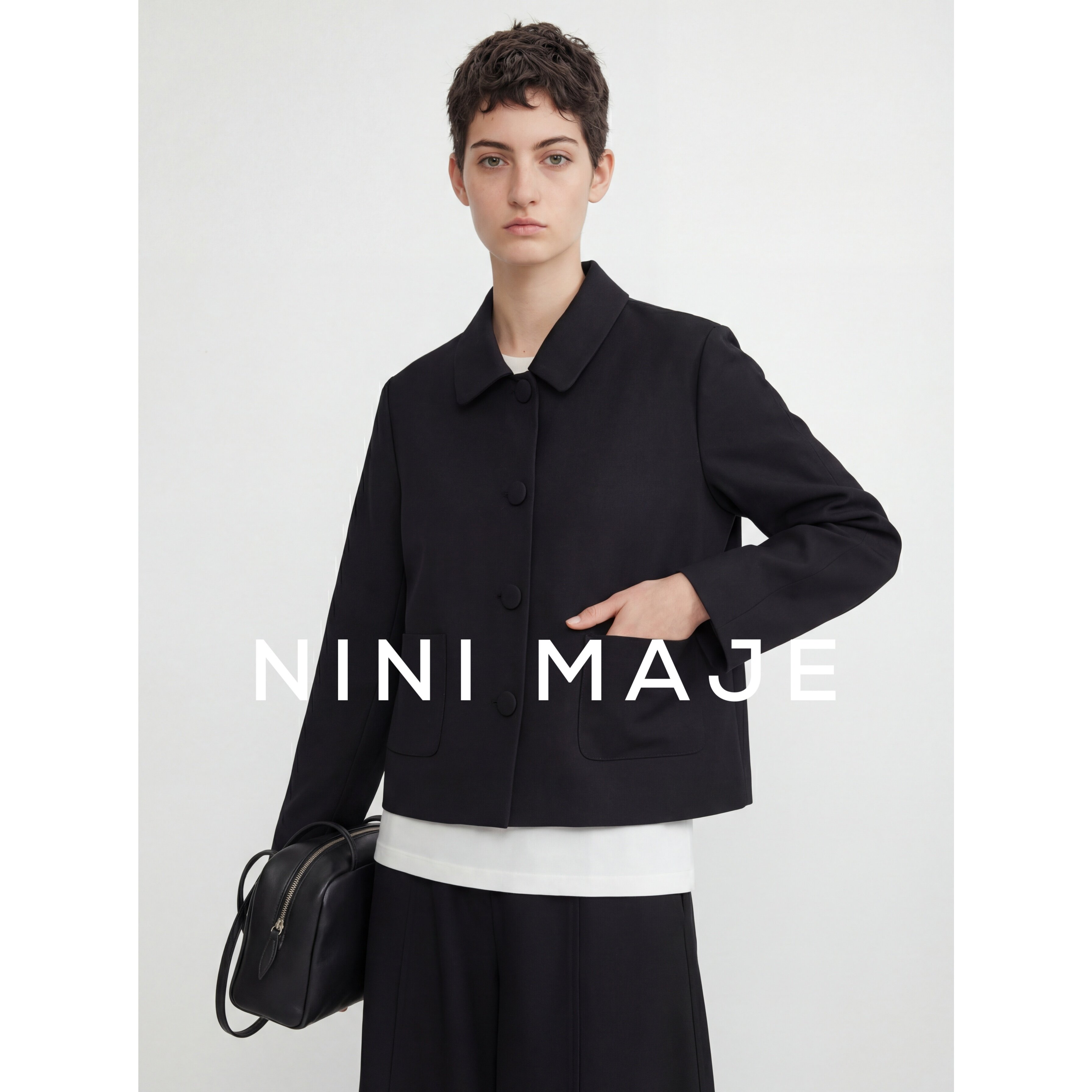 NANBEIBEI南北贝黑色短款风衣外套女春季宽松型纽扣翻领口袋时尚