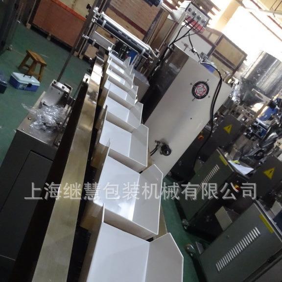 芝麻丸自动包装机黑芝麻丸充氮气包装机单个手投链斗包装机