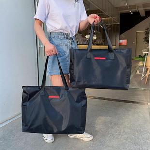 装衣服的手提袋子帆布收纳袋大容量整理学生男女行李包可套拉杆箱