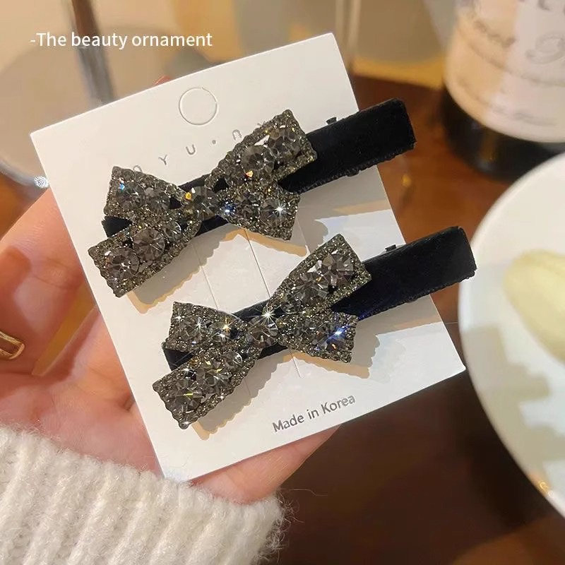 简约蝴蝶结水钻鸭嘴夹黑色发饰
