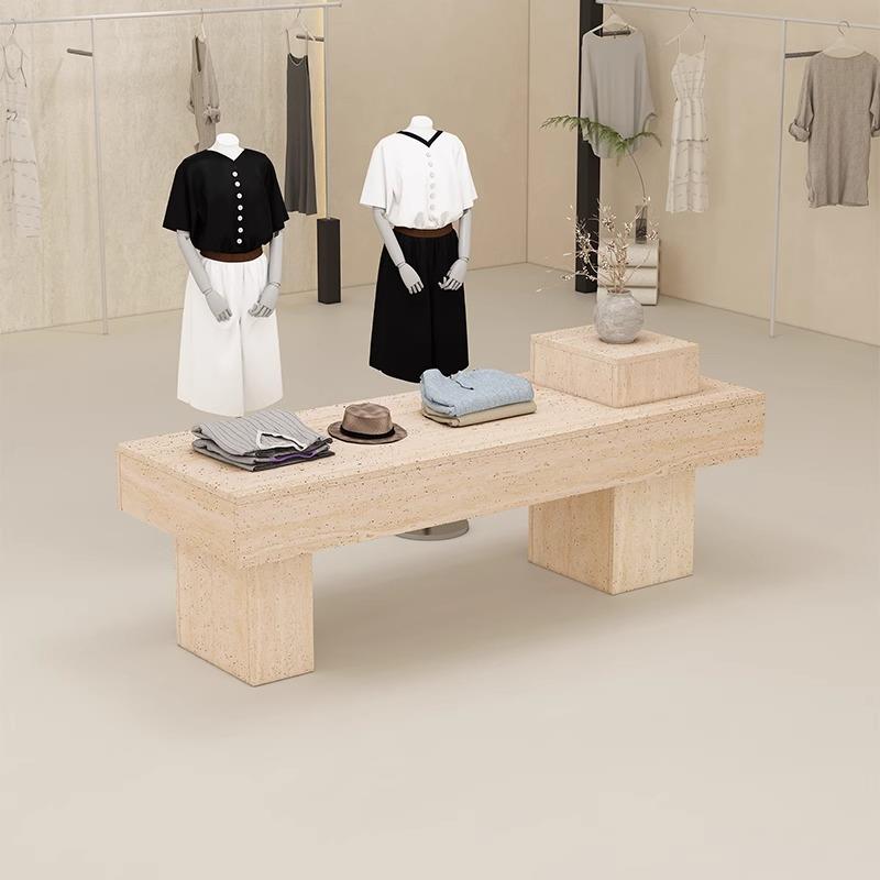 服装店中岛台女装店铺中间流水台简约现代洞石纹展示桌鞋包展示柜