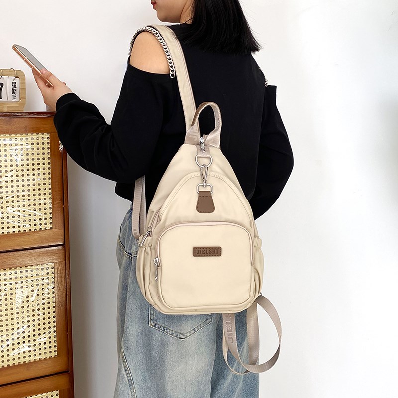 简约女包夏季新款双肩包大容量休闲多功能斜挎旅行包帆布小背包