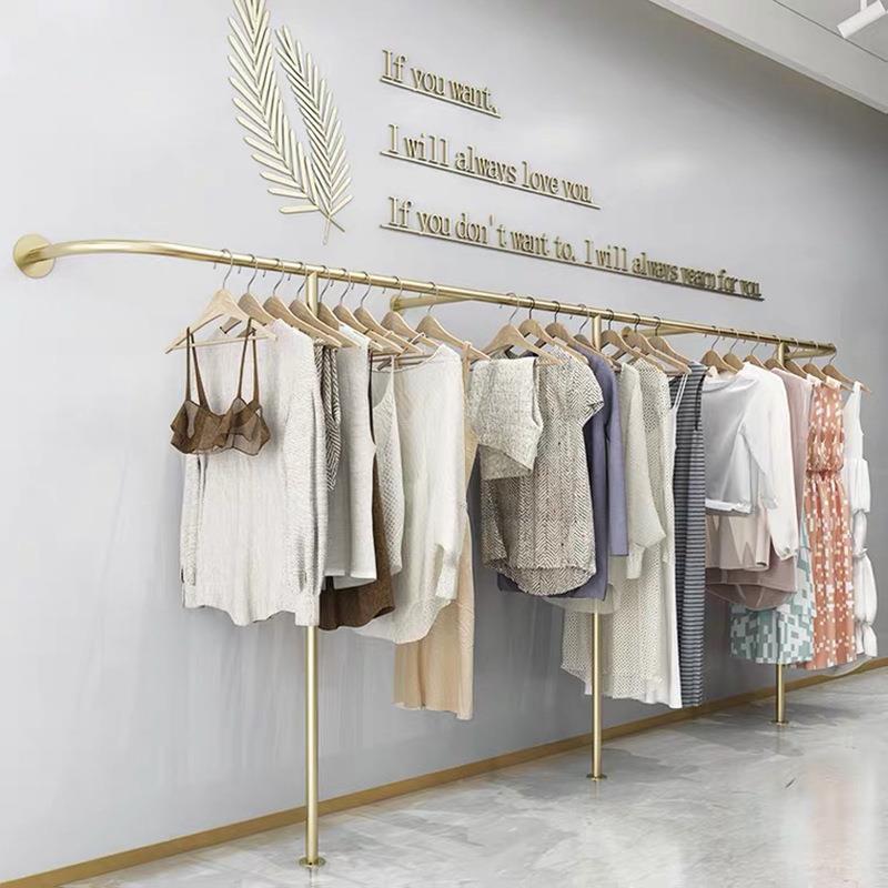 服装店衣架展示架上墙壁挂异形创意童装金色女装店时尚衣服货架
