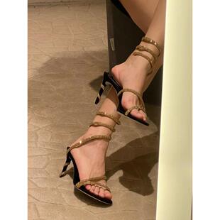 夏季新款RC露趾水钻蛇形缠绕一字带中空凉鞋女性感黑金细跟高跟鞋