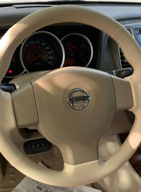 适用于日产经典轩逸方向盘套真皮骊威颐达老骐达把套专用手缝全包