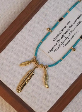 张十六铜合金羽毛串珠毛衣链