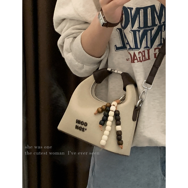 韩版时尚手提包小拎包包女2025新款时尚帆布水桶包简约单肩斜挎包