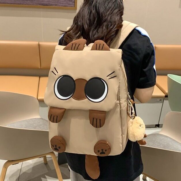 韩版新款书包轻便大容量小学生可爱百搭包学生双肩包丑萌猫咪背包