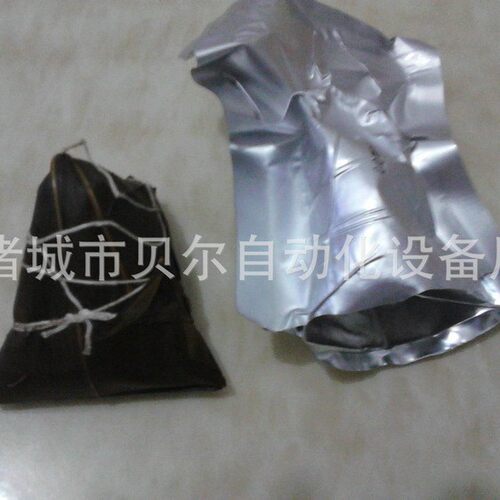 自动铝箔双面拉伸包装机-切圆角真空包装机-贝尔牛肉干豆干包装机