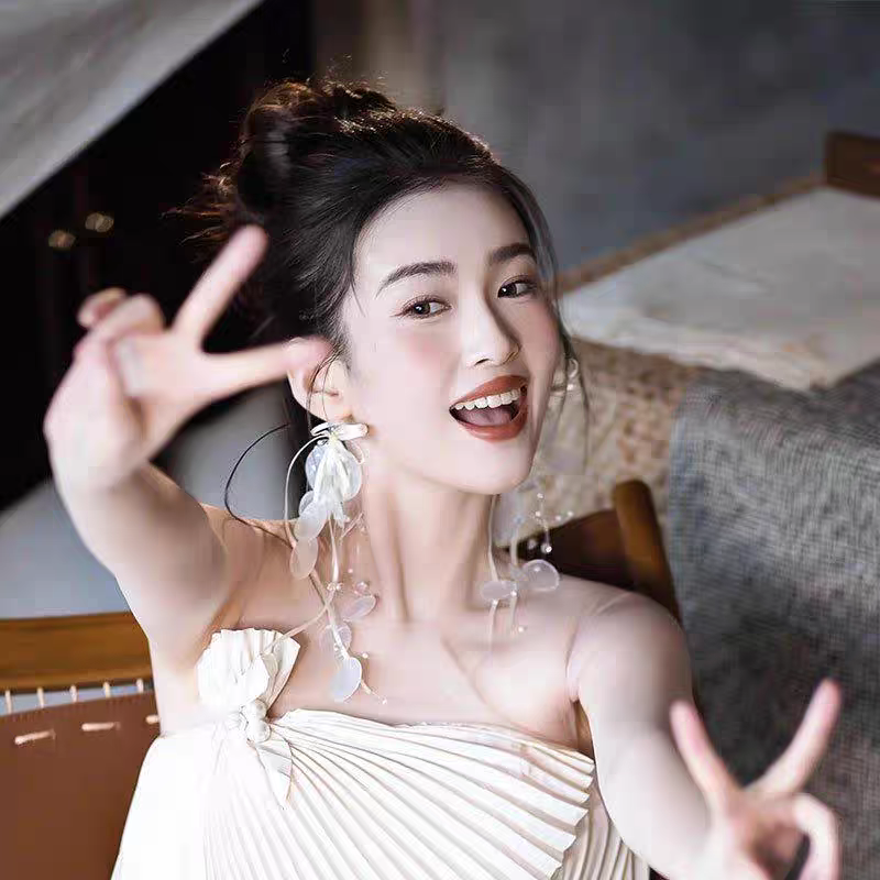 超仙蝴蝶结贝壳流苏耳环女甜美高级感显脸小耳夹长款飘带新娘耳饰