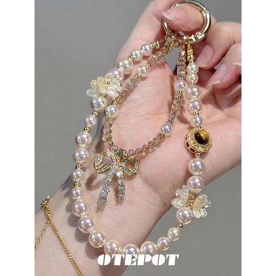 复古美拉德虎眼色香槟珍珠手机链高端轻奢手机挂饰小众包挂件挂链