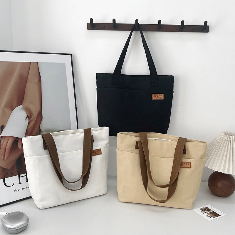 学生轻便单肩包简约大容量帆布包女百搭通勤文艺托特包手提布袋包