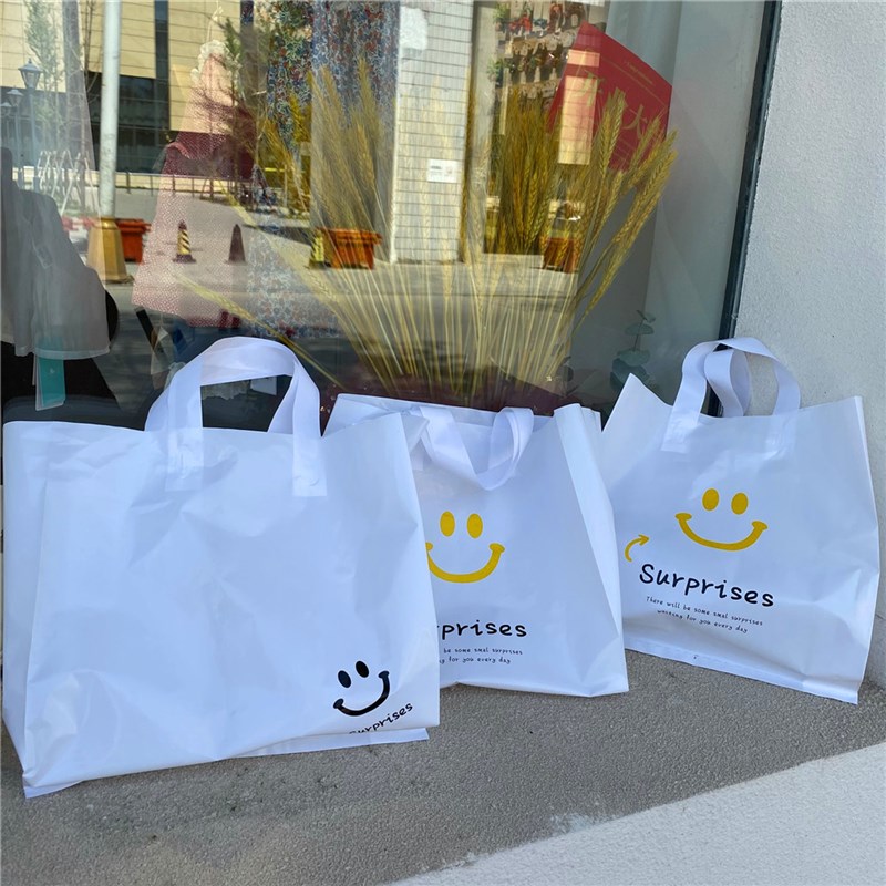 惊喜网红新笑脸卡通可爱ins风塑料服装店手提袋盒子收纳化妆礼品