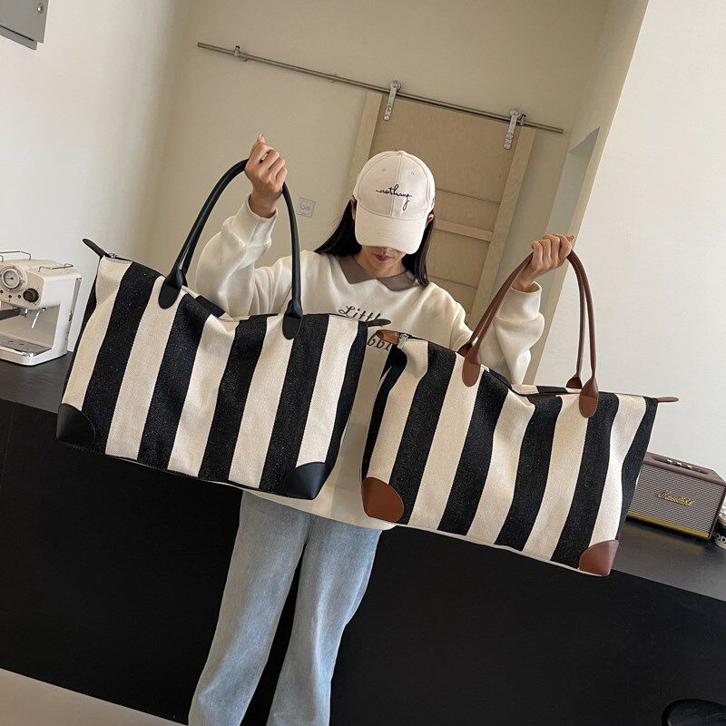 大容量旅行包帆布女休闲布包大号轻便2025新款短途超大号行李袋