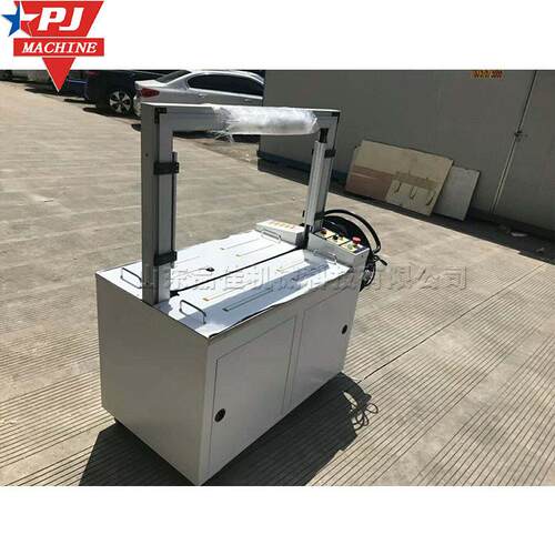纸箱pp带捆扎缠绕机 热熔塑料袋包扣捆扎设备 自动扎带打包机