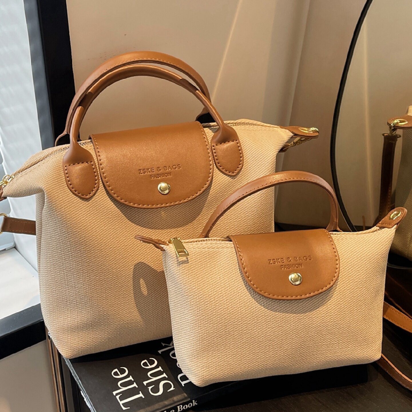 上班通勤包女2025新款时尚休闲帆布斜挎包上班族小拎包手提饺子包