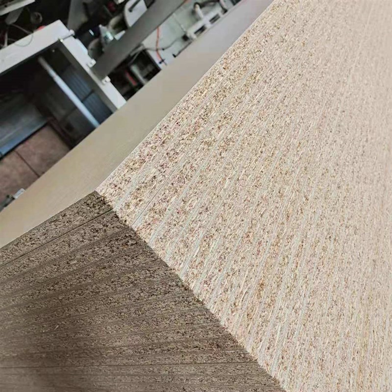 供应E0级生态板刨花板 实木颗粒板贴面板 电脑桌面实木板产地货源