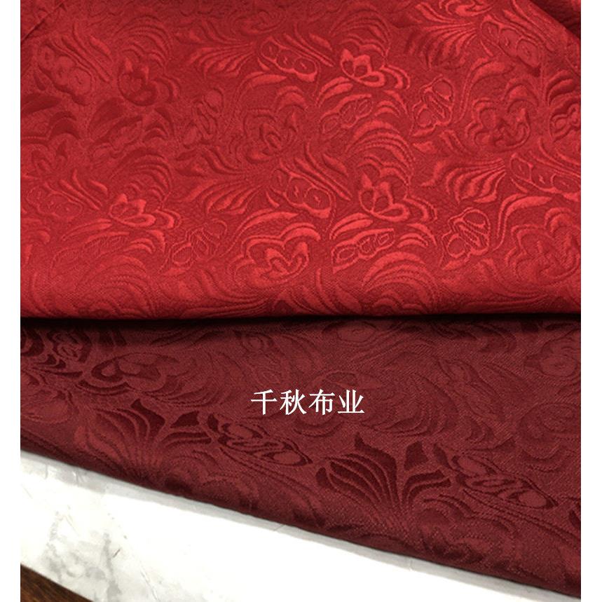 促销暗酒红色涤棉提花蝴蝶花布料 浮雕立体凸面花纹重磅提花面料