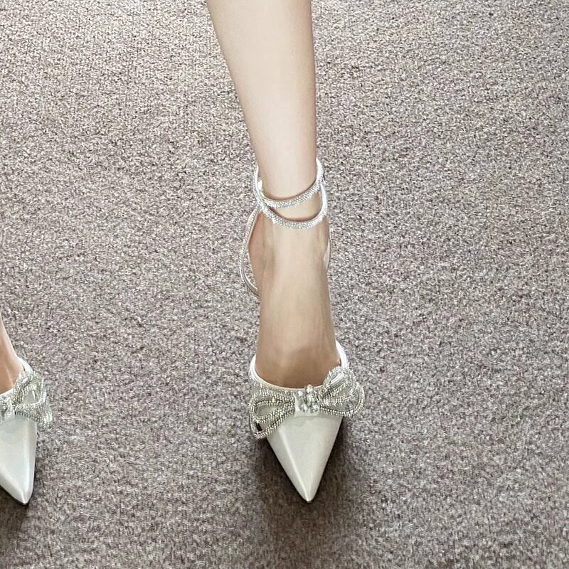 尖头高跟鞋女2025春秋款白色蝴蝶结水钻交叉扣带细跟法式包头凉鞋