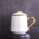 厂家陶瓷带盖杯子创意礼品办公会议茶水广告金柄骨瓷茶漏盖杯