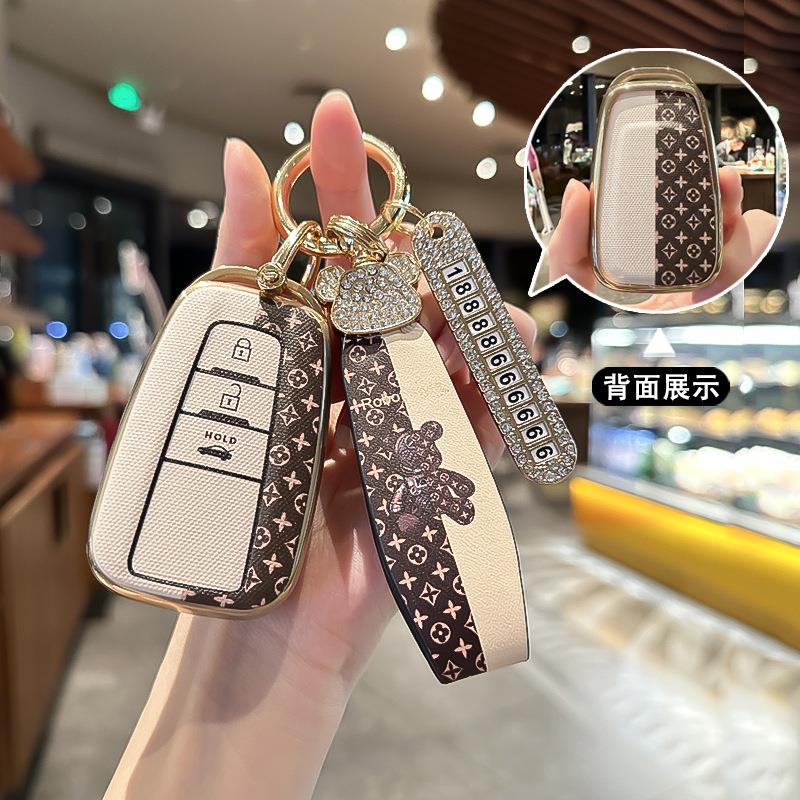 适用丰田钥匙套新款凯美瑞威兰达亚洲龙RAV4荣放卡罗拉车包扣女