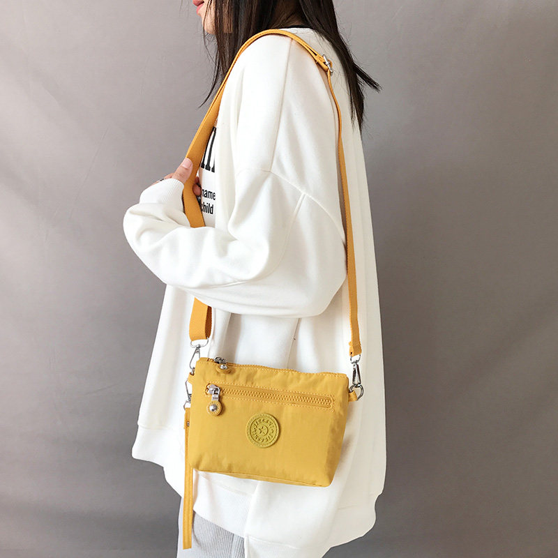 手拎包女小包斜挎迷你包帆布单肩20E21年新款手机手腕包防水零钱