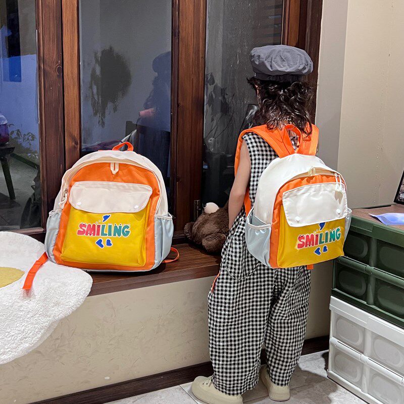 新款儿童书包韩版男童撞色百搭小学生双肩包幼儿园T女孩宝宝小揹