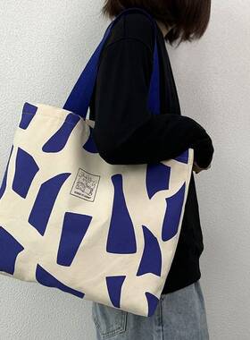 通勤大容量蓝色单肩帆布包男女学生上课装书手提袋2025年春夏新款