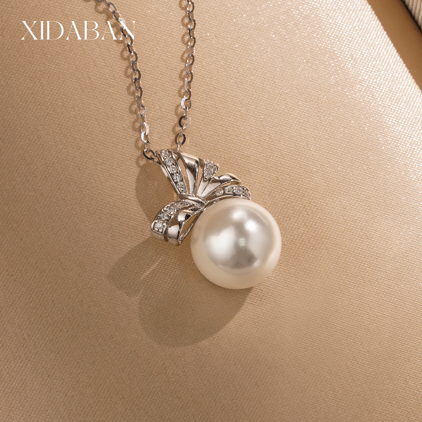 西大班施家珍珠蝴蝶结耳环通体银