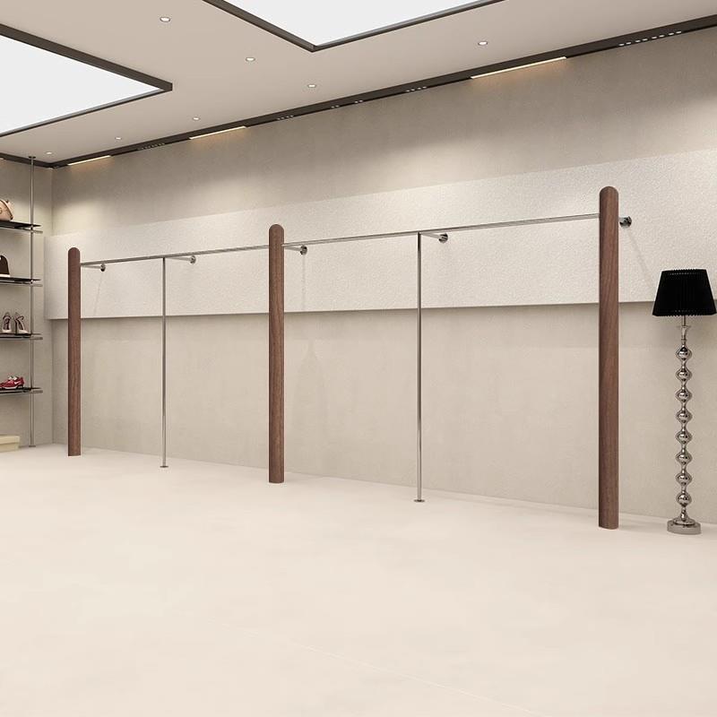 服装店不锈钢展示架上墙挂衣杆覆古胡桃木纹色女装店货架陈列货架