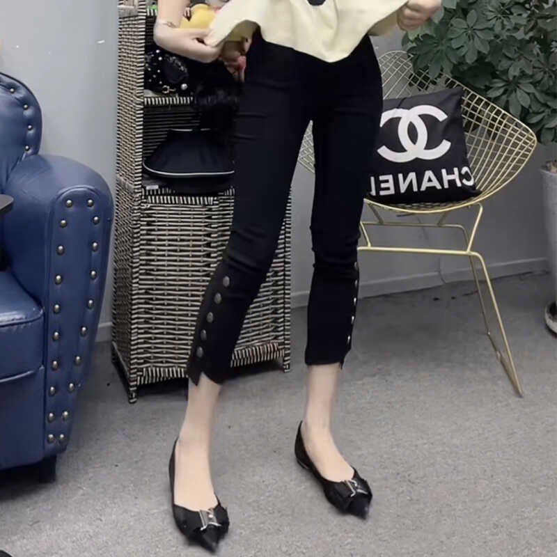 欧货夏季钮扣纸皮裤女松紧腰不规则裤脚弹力百搭时U尚九分铅笔裤