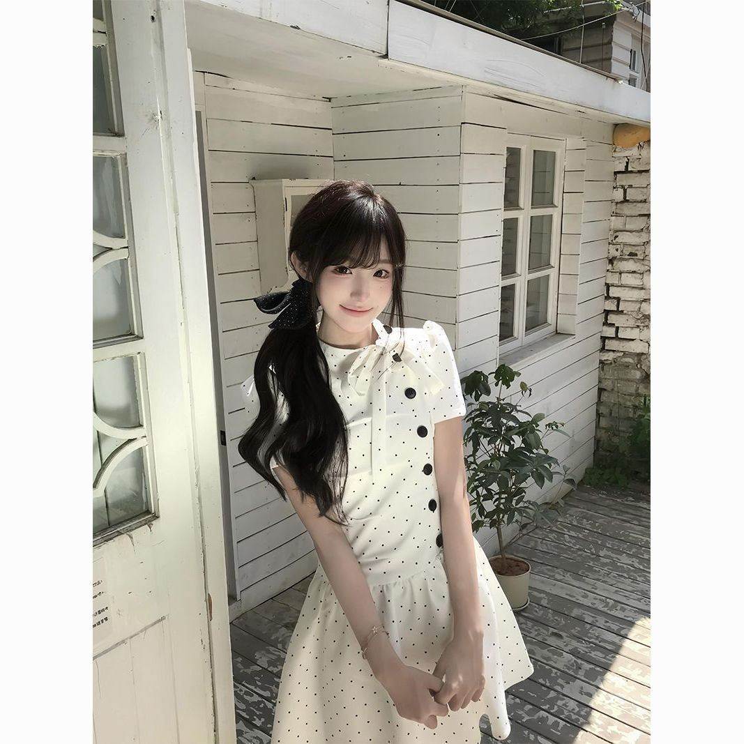 韩系小众波点蝴蝶结A字连衣裙女2026夏季新款显瘦褶皱设计感裙