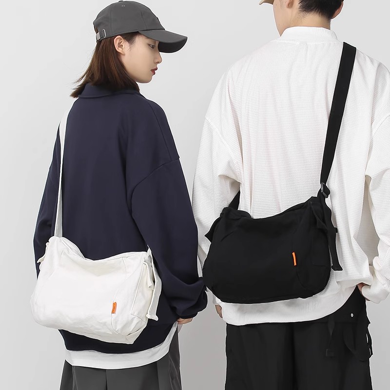 日本MUJIE单肩包男女2025新款帆布斜挎包ins潮牌挎包学生背包邮
