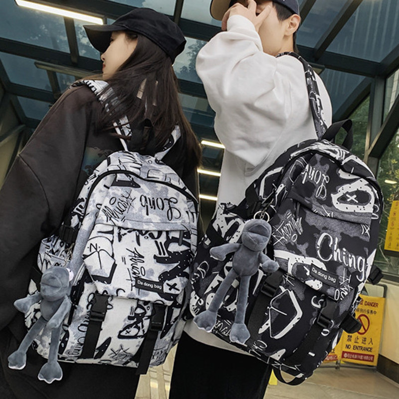 中学生书包男生时尚潮流个性双肩包初中生高中生耐脏大容量背包女