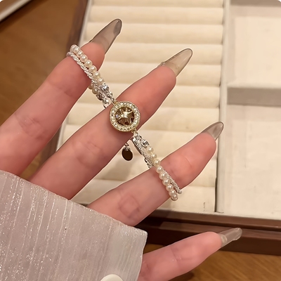 金色圆形八芒星珍珠缠绕手链女款2025新款轻奢小众精致高级感手串