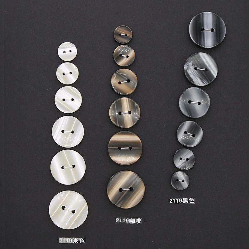 现货供应 二眼平面仿贝壳树脂纽扣 男女大衣风衣西装衬衫扣子钮扣