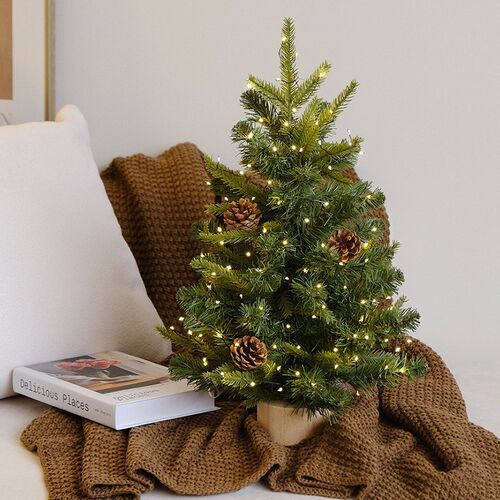 Snow-covered Christmas tree, desktop Christmas decoration