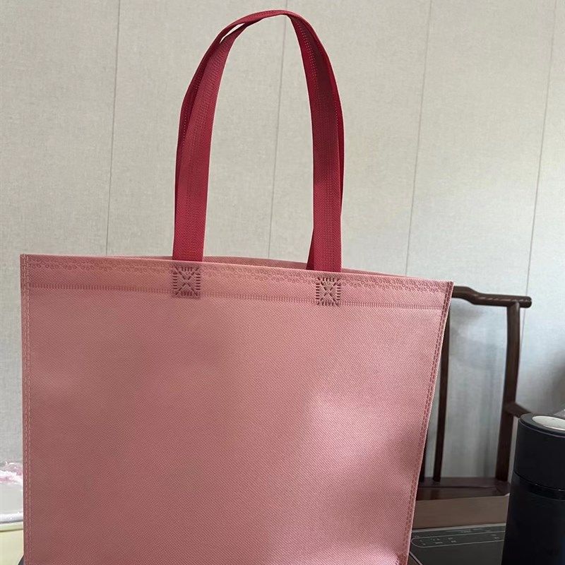 粉红色无纺布挎包袋定p制服装袋羽绒服袋棉衣袋超大号50*40*10