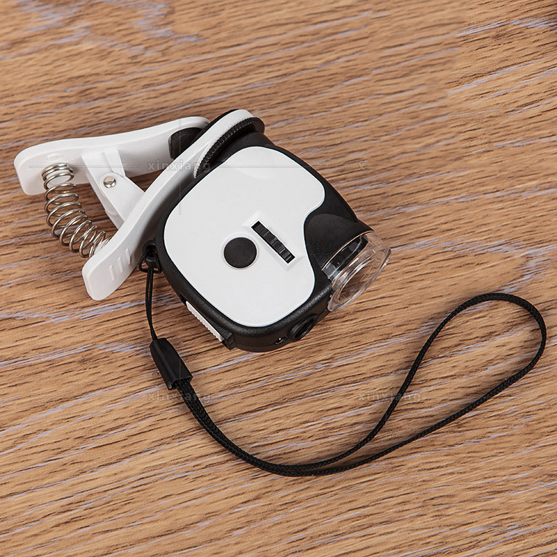 新款带手机夹子55倍迷你显微镜带LED灯UV验钞灯高倍放大镜7004DB